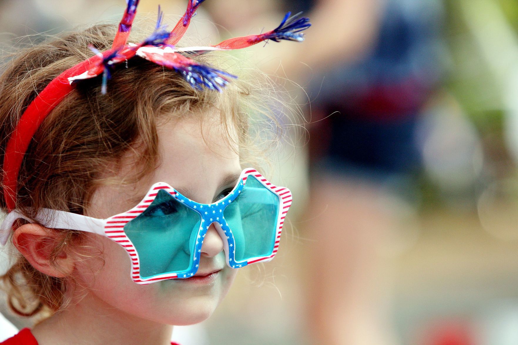 Girl with red white and blue star glasses